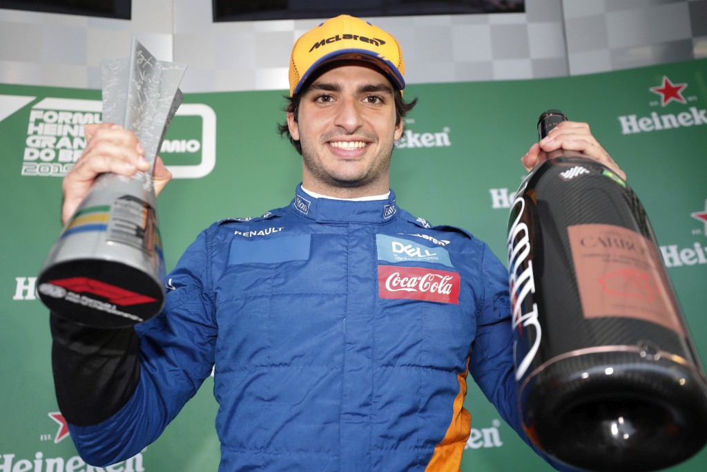 Carlos Sainz Jr, McLaren, celebrates on the podium Карлос Сайнц
